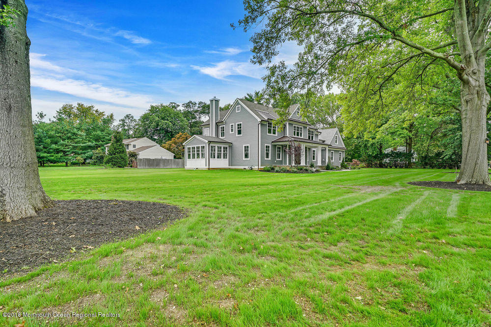 99 Rivers Edge Drive Little Silver, NJ 07739 - Photo 45 of 50 a view of a house with a big yard