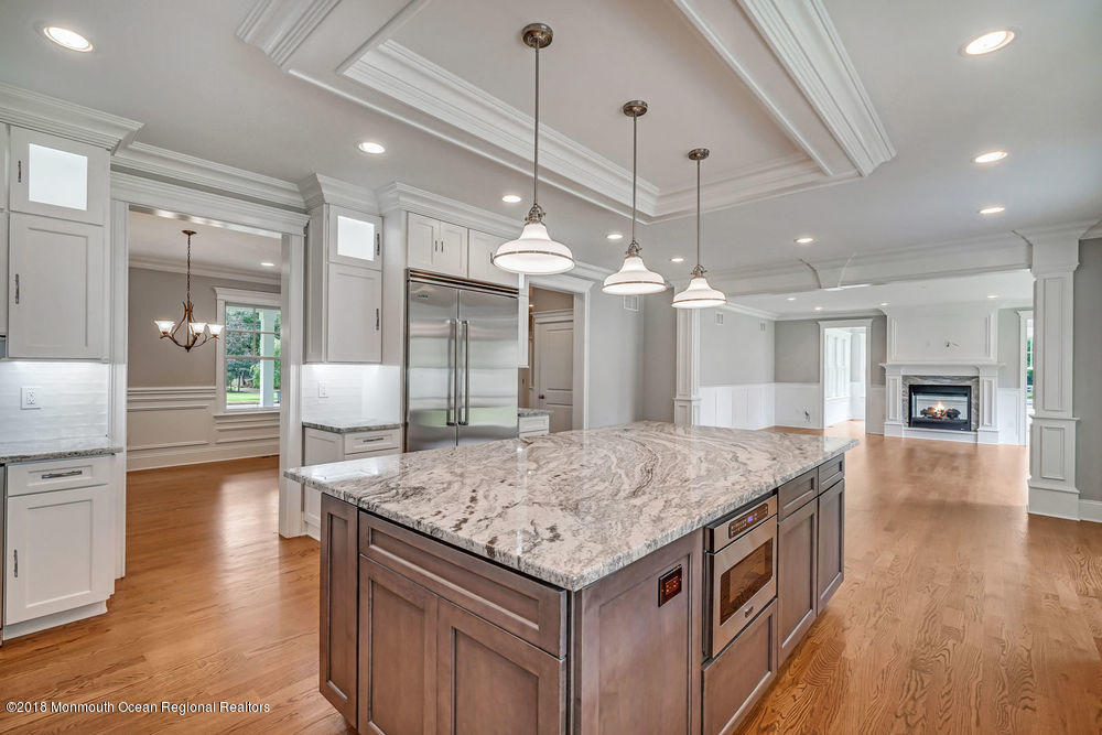 99 Rivers Edge Drive Little Silver, NJ 07739 - Photo 7 of 50 a kitchen with a counter space wooden floor and appliances