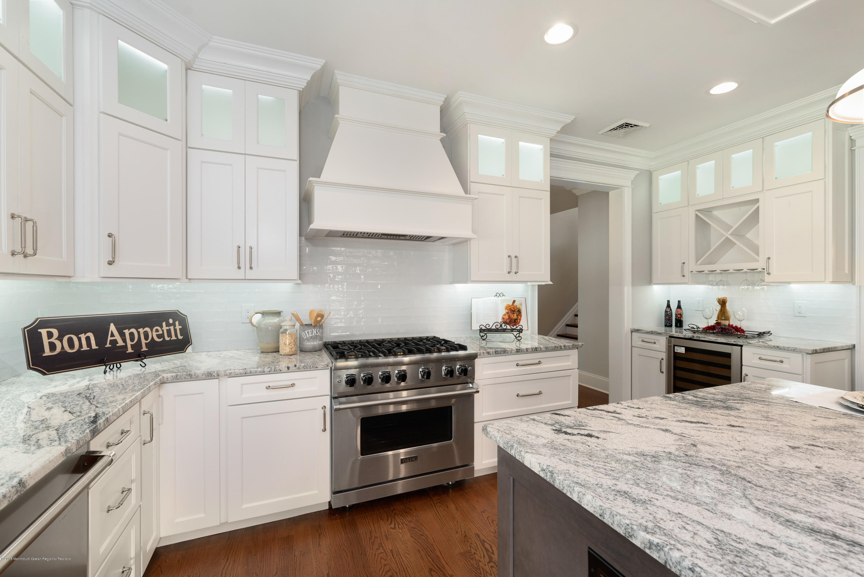 99 Rivers Edge Drive Little Silver, NJ 07739 - Photo 8 of 50 a kitchen with granite countertop a stove top oven sink and cabinets