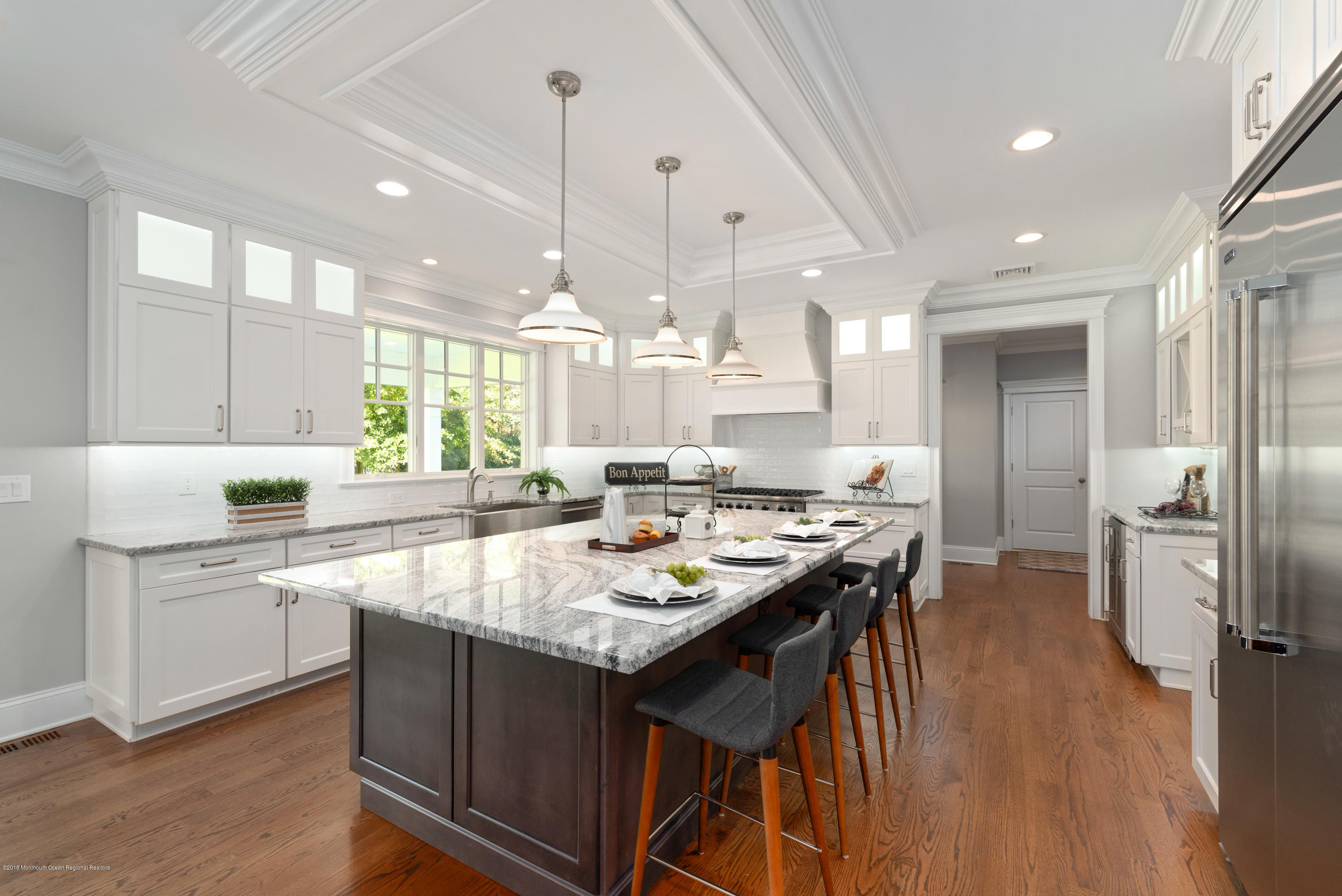 99 Rivers Edge Drive Little Silver, NJ 07739 - Photo 10 of 50 an open kitchen with kitchen island a stove a sink a refrigerator and chairs