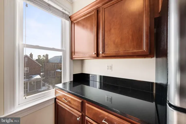 a kitchen with a sink and large window