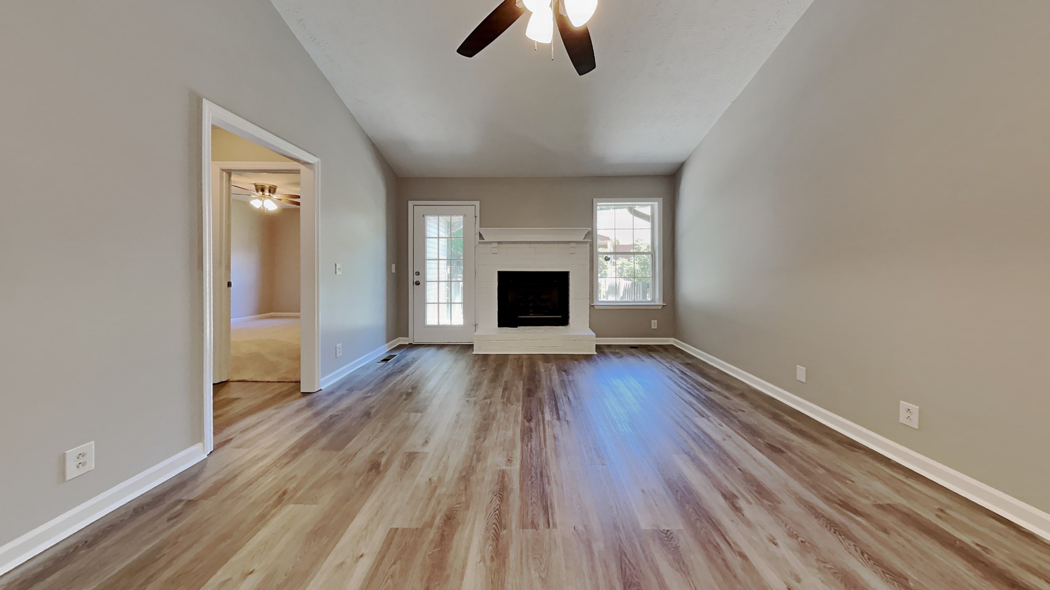 728 Bishopsgate Road Antioch, TN 37013 - Photo 3 of 15 wooden floor fireplace and natural light in living room