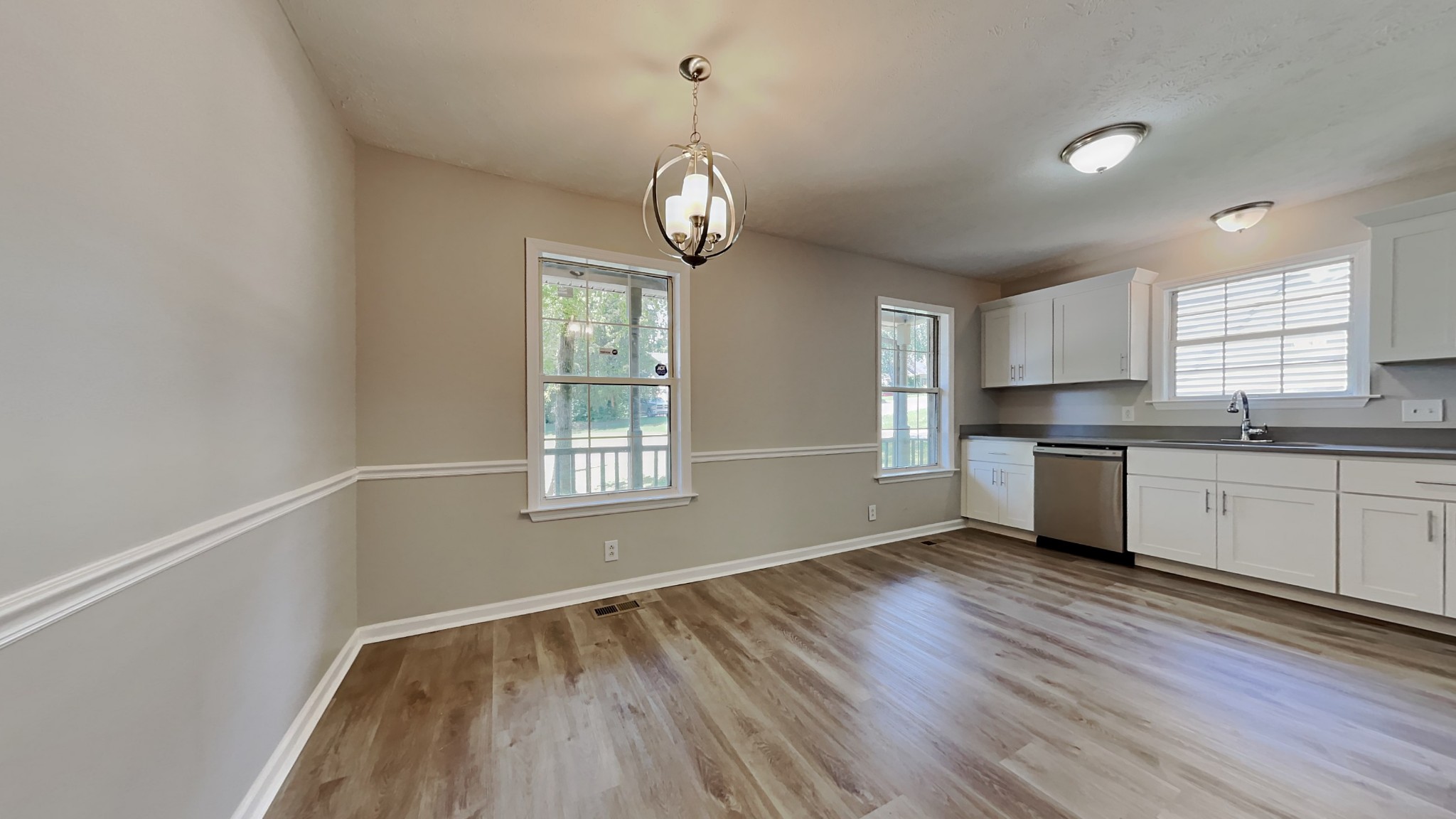 728 Bishopsgate Road Antioch, TN 37013 - Photo 6 of 15 a view of an empty room with window and wooden floor