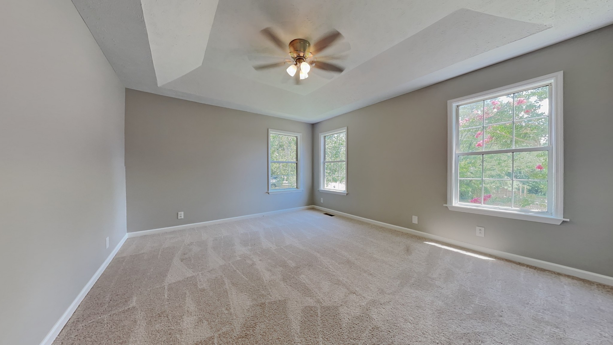 728 Bishopsgate Road Antioch, TN 37013 - Photo 7 of 15 an empty room with windows and ceiling fan