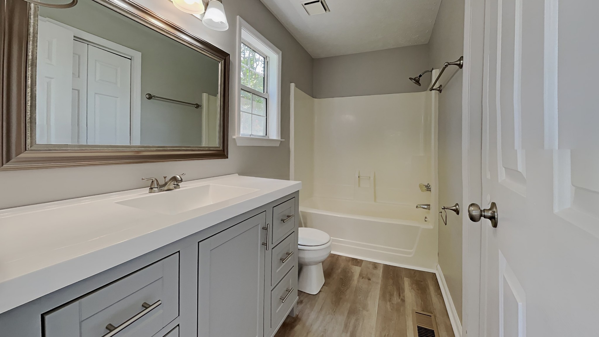 728 Bishopsgate Road Antioch, TN 37013 - Photo 8 of 15 a bathroom with a sink a toilet and shower