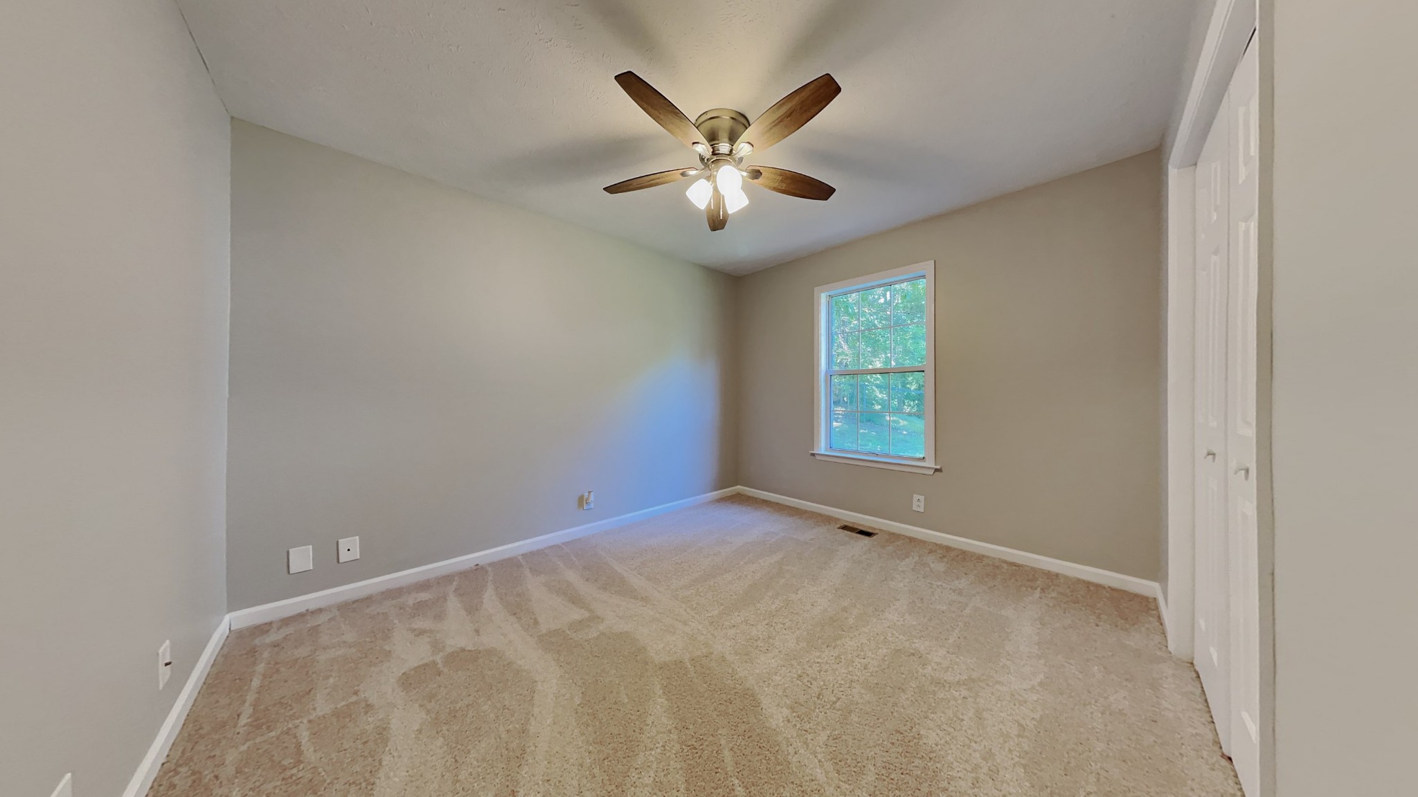 728 Bishopsgate Road Antioch, TN 37013 - Photo 9 of 15 an empty room with window and ceiling fan
