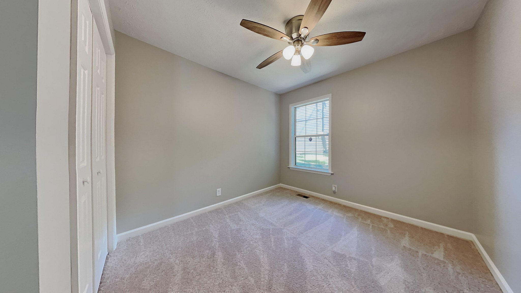 728 Bishopsgate Road Antioch, TN 37013 - Photo 10 of 15 an empty room with windows and fan