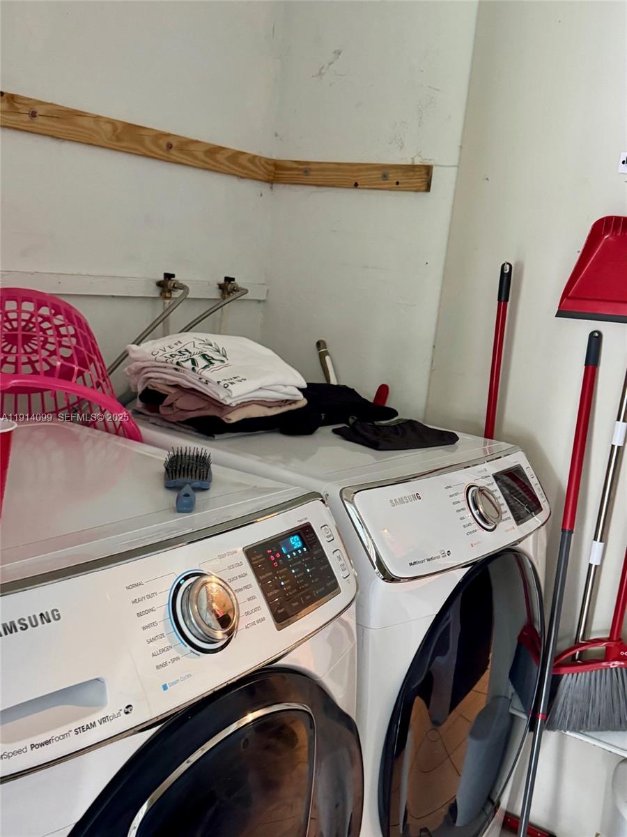 260 Southwest 8th Avenue, Unit B Hallandale Beach, FL 33009 - Photo 15 of 23 a utility room with dryer and washer