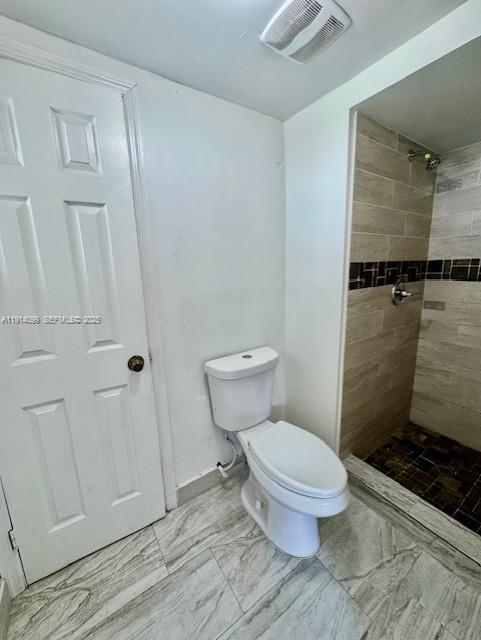 260 Southwest 8th Avenue, Unit B Hallandale Beach, FL 33009 - Photo 18 of 23 a bathroom with a toilet and a shower