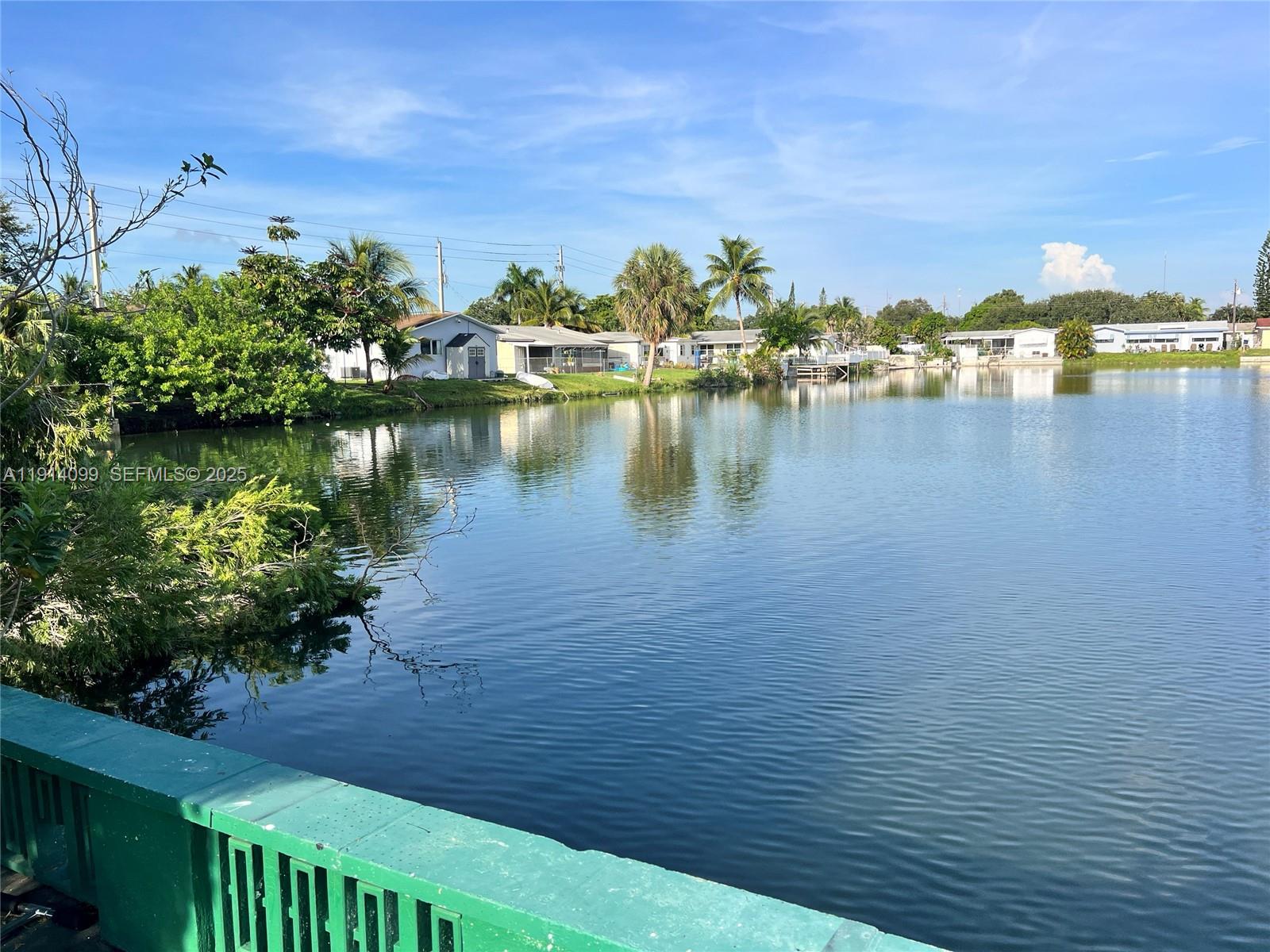 260 Southwest 8th Avenue, Unit B Hallandale Beach, FL 33009 - Photo 20 of 23 a view of a lake with houses in the back