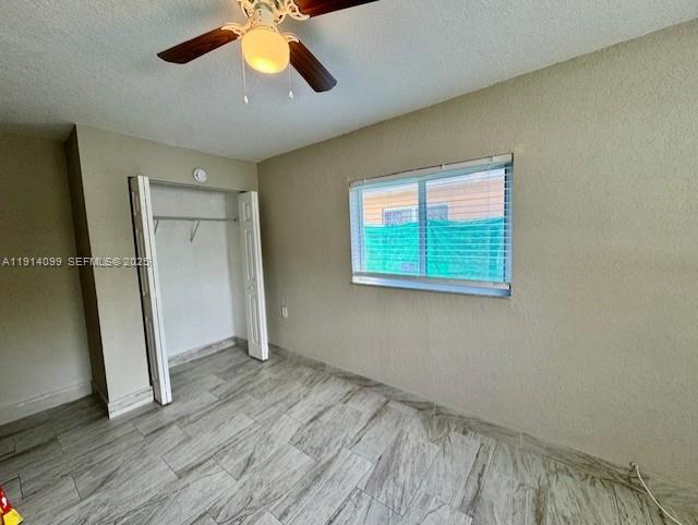 260 Southwest 8th Avenue, Unit B Hallandale Beach, FL 33009 - Photo 8 of 23 a view of empty room with wooden floor and fan