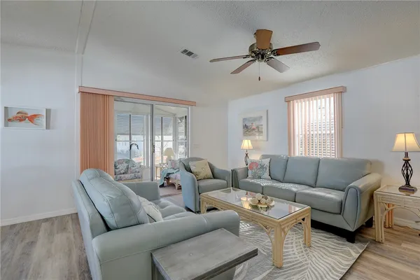 a living room with furniture and a window