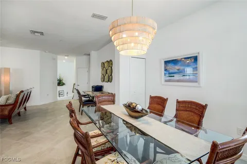 a workspace with furniture and chandelier