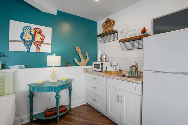 a room with cabinets and wooden floor