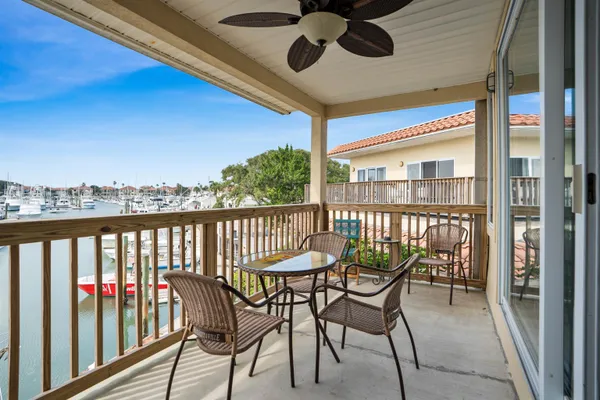 a view of a balcony with chairs