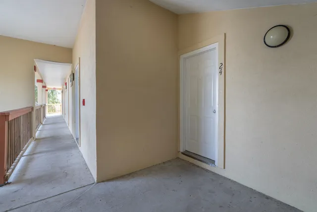 a view of a room with wooden floor