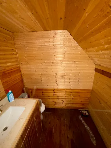 a view of a wooden deck with a bench