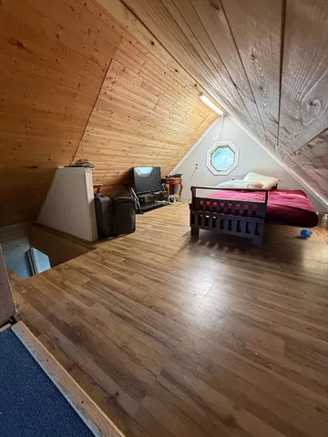 a view of an empty room with windows