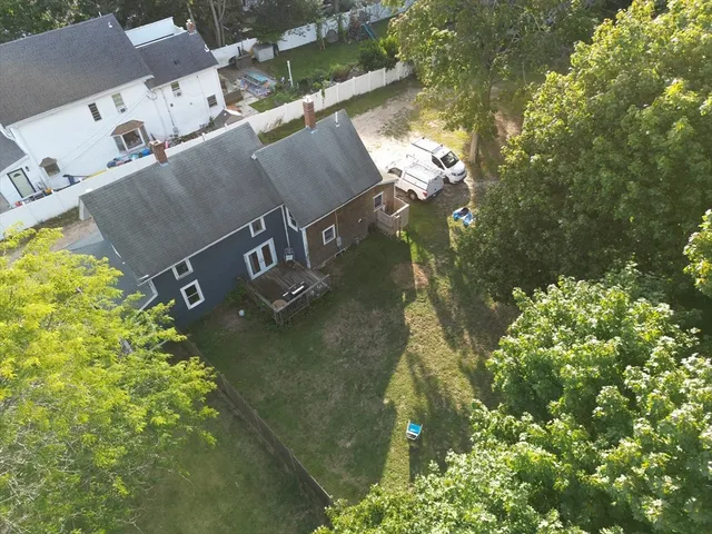 an aerial view of residential houses with outdoor space
