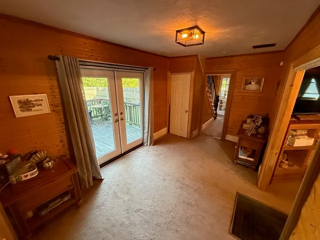 a kitchen with granite countertop a sink stove and refrigerator