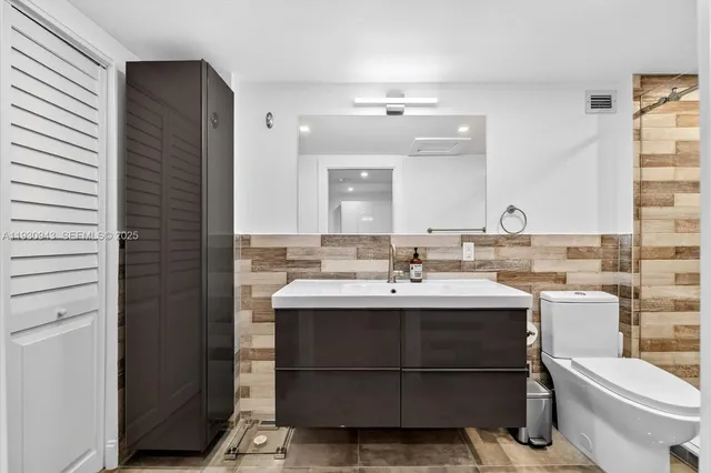 a bathroom with a sink and a toilet