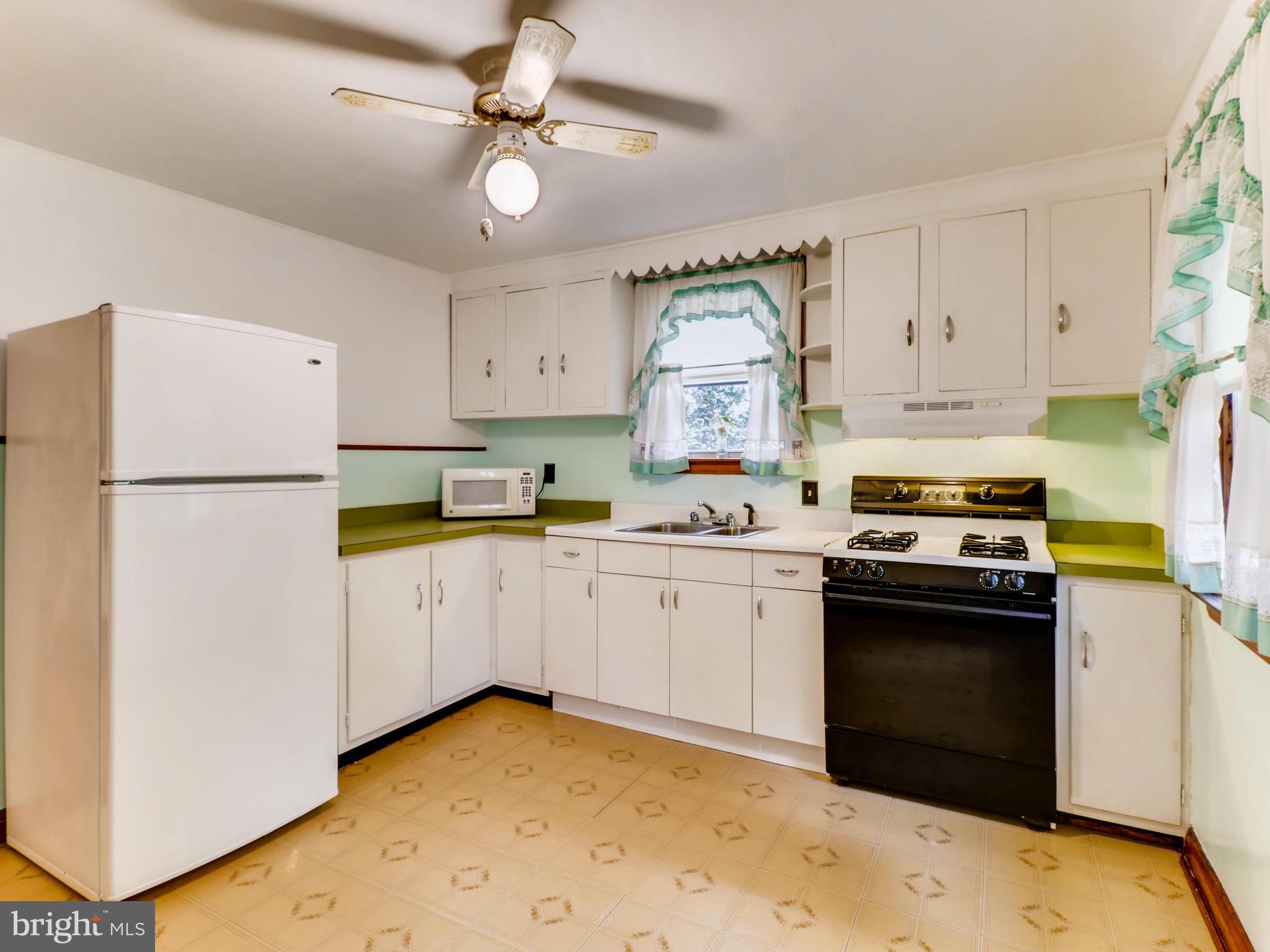 4 A Northship Road Baltimore, MD 21222 - Photo 11 of 28 Bright sunny kitchen leads to deck