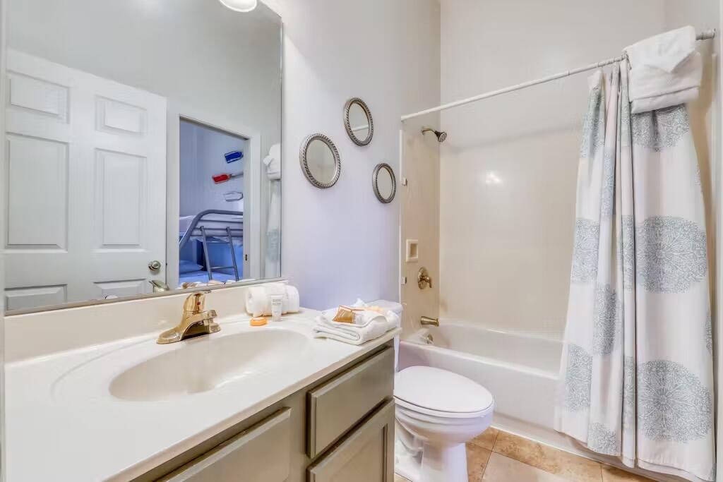 10343 East County Highway 30A, Unit 328 Inlet Beach, FL 32413 - Photo 11 of 16 a bathroom with a granite countertop sink toilet and shower