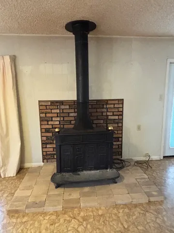 a view of fireplace with wooden floor