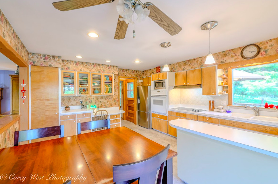 14028 Nichols Road Hebron, IL 60034 - Photo 17 of 94 a large kitchen with a table and chairs