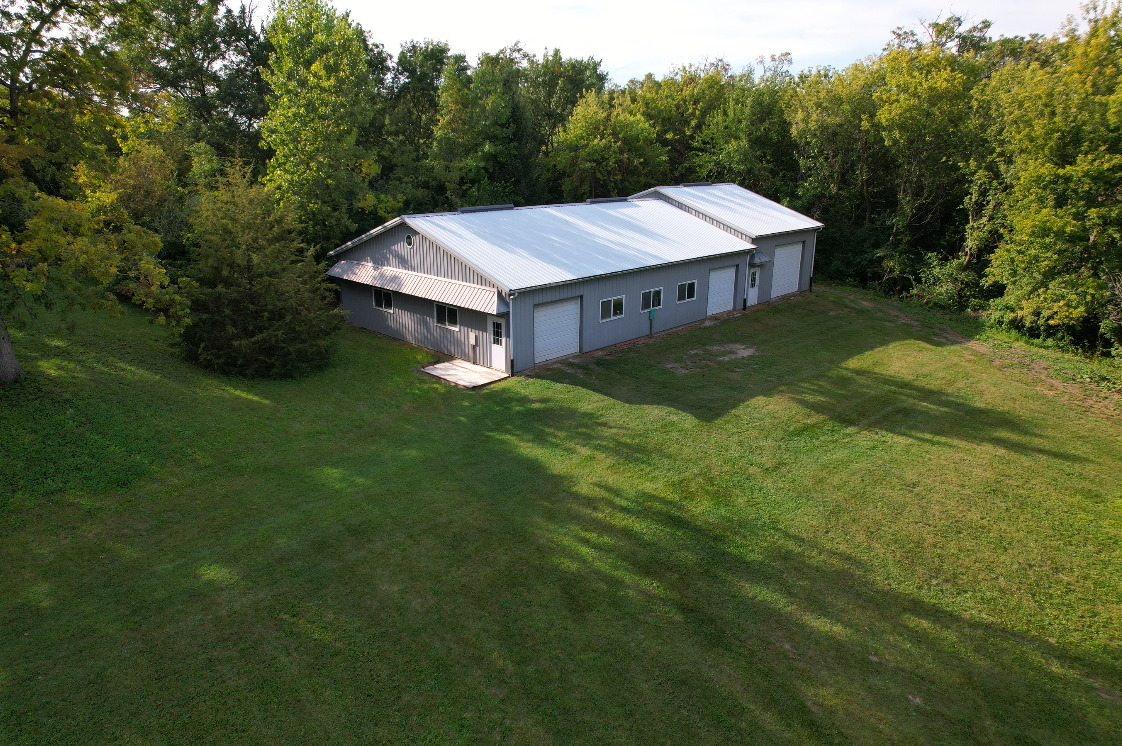 14028 Nichols Road Hebron, IL 60034 - Photo 52 of 94 a aerial view of a house next to a big yard with large trees