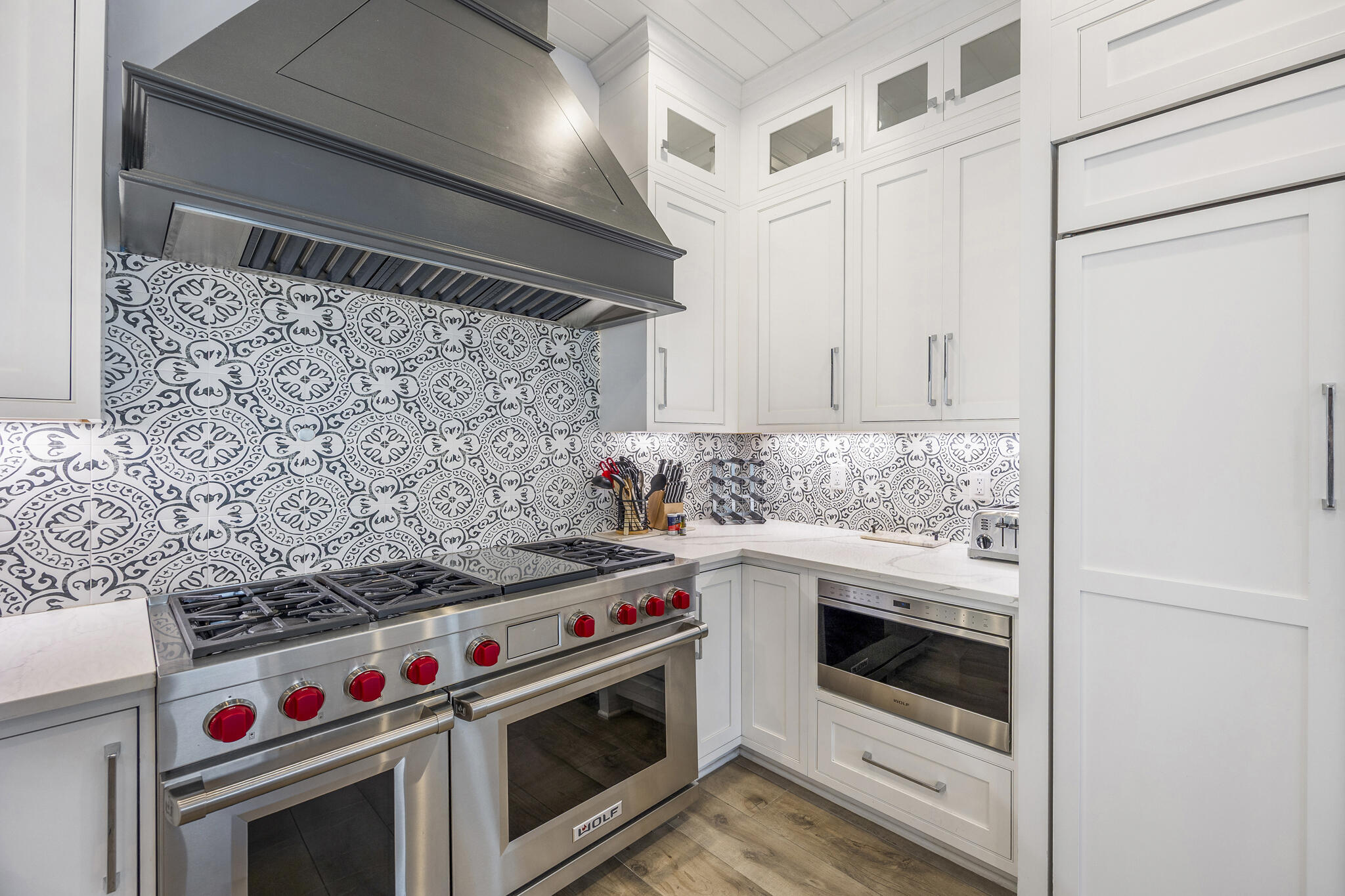 26 Azzurro Way, Unit A Santa Rosa Beach, FL 32459 - Photo 15 of 60 a utility room with stove top oven and cabinets