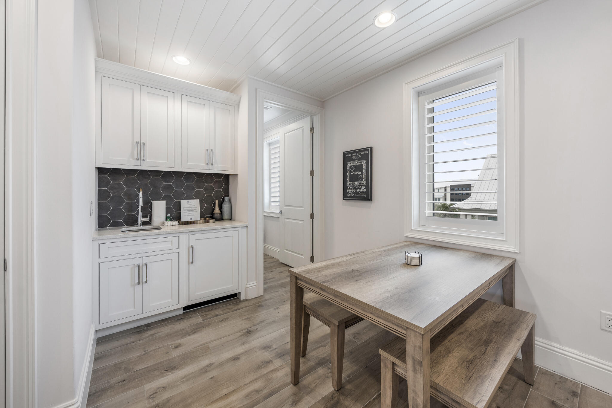 26 Azzurro Way, Unit A Santa Rosa Beach, FL 32459 - Photo 22 of 60 a kitchen with a sink cabinets and wooden floor