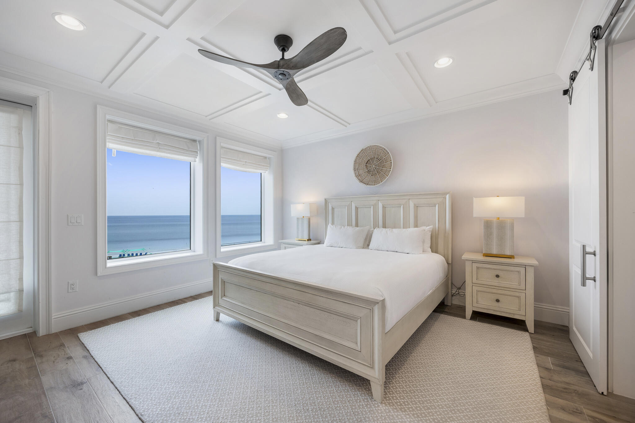 26 Azzurro Way, Unit A Santa Rosa Beach, FL 32459 - Photo 25 of 60 a spacious bedroom with a bed chandelier and a window