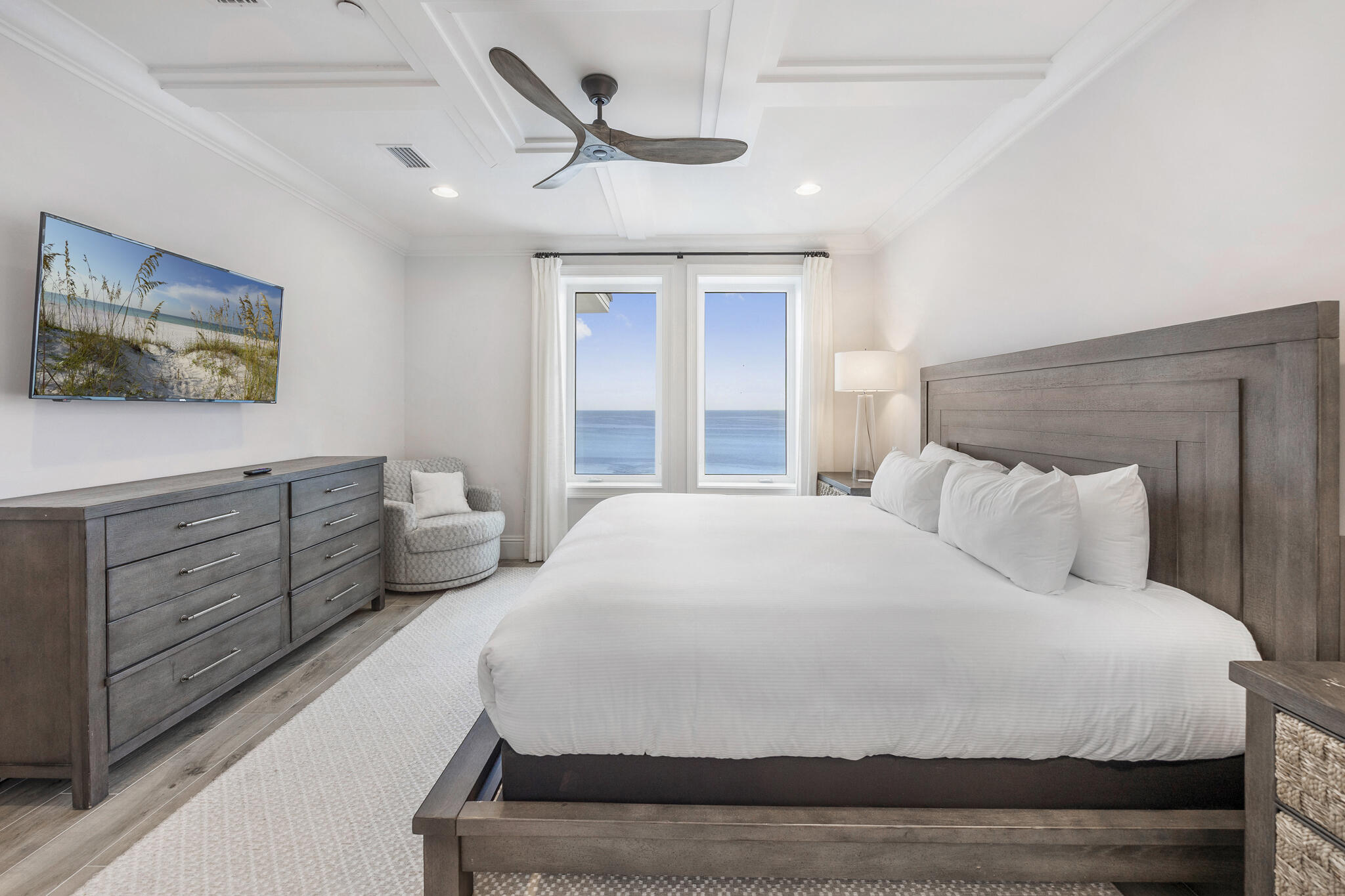 26 Azzurro Way, Unit A Santa Rosa Beach, FL 32459 - Photo 38 of 60 a bedroom with a large bed and a chandelier