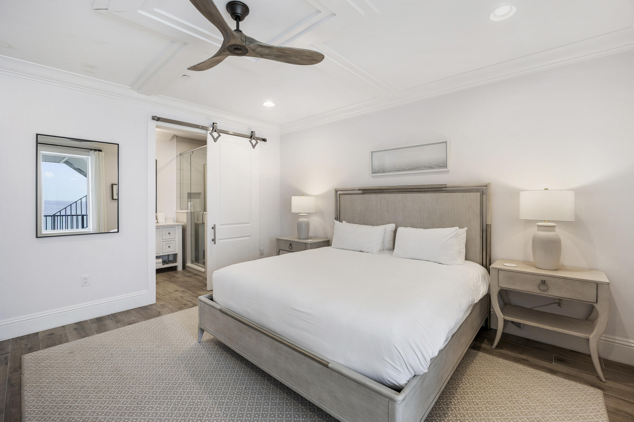 26 Azzurro Way, Unit A Santa Rosa Beach, FL 32459 - Photo 44 of 60 a bedroom with a bed and a chandelier