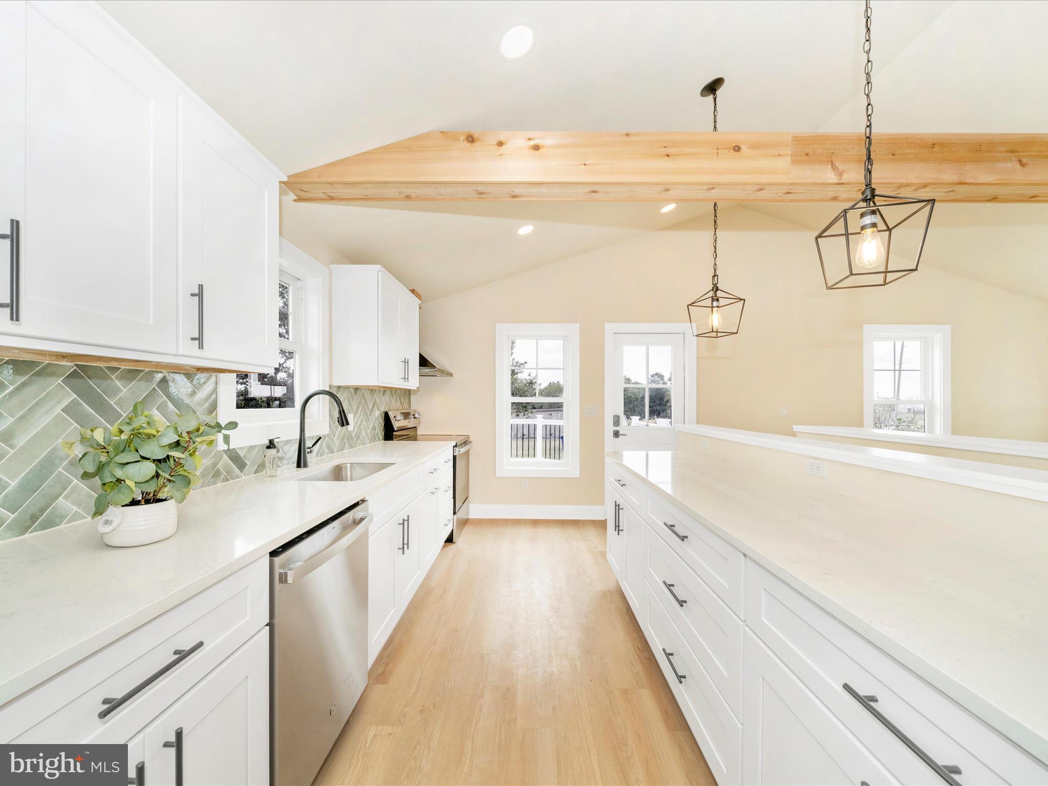 14901 New Windsor Road New Windsor, MD 21776 - Photo 11 of 75 a large white kitchen with a sink and dish washer