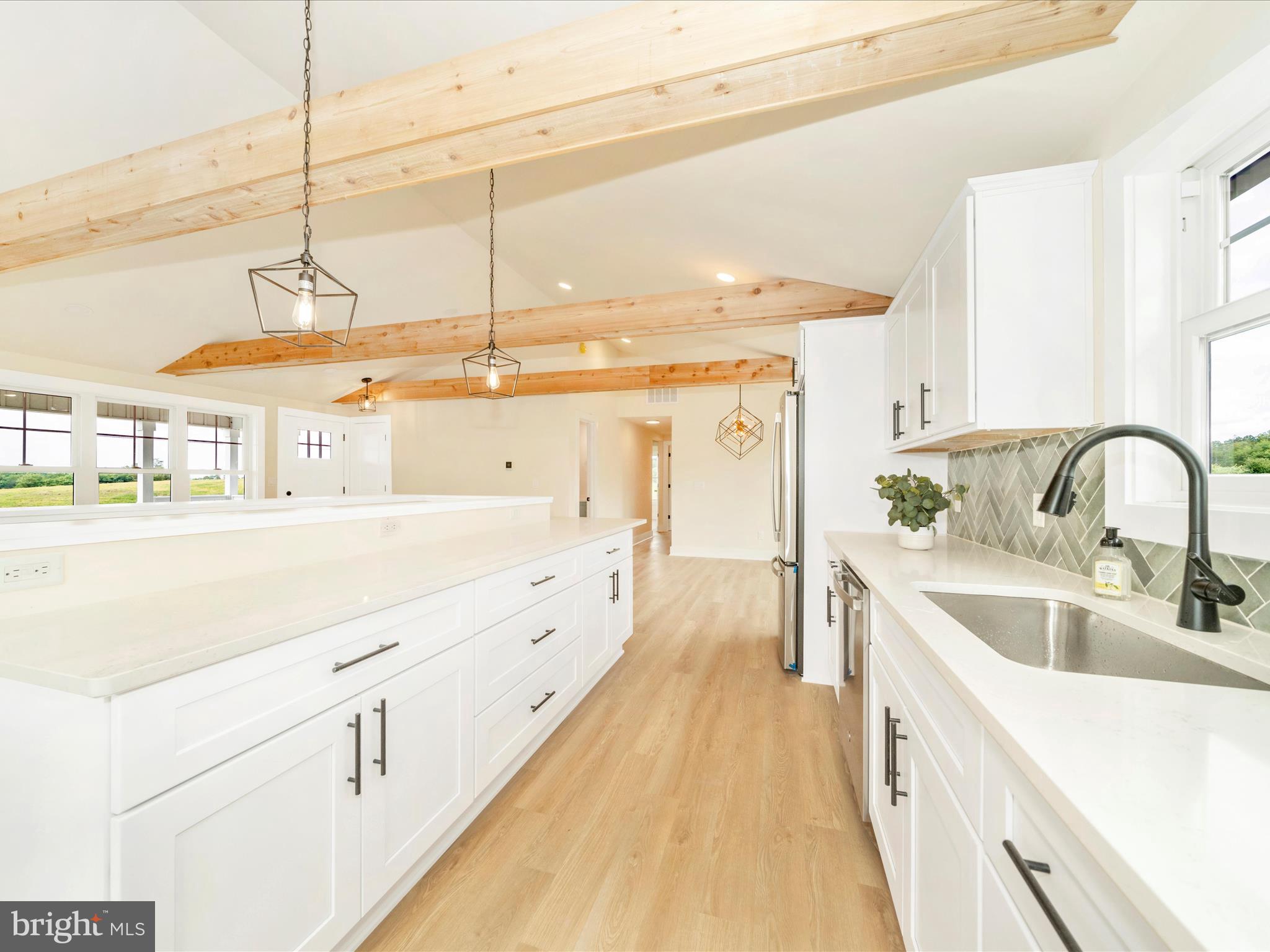 14901 New Windsor Road New Windsor, MD 21776 - Photo 13 of 75 a spacious bathroom with a double vanity sink and a large mirror