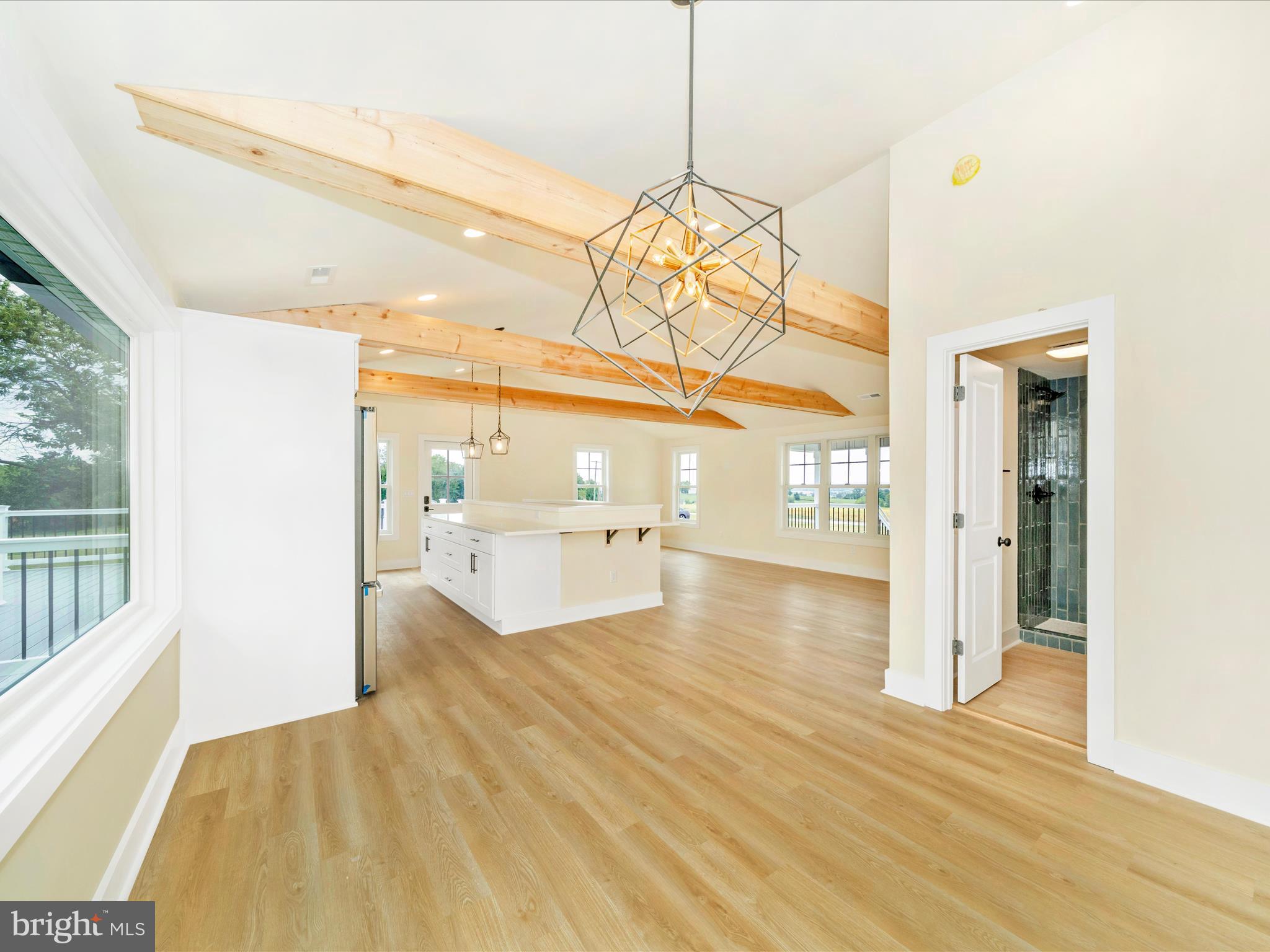 14901 New Windsor Road New Windsor, MD 21776 - Photo 17 of 75 a view of a living room with a lot of kitchen space and wooden floor