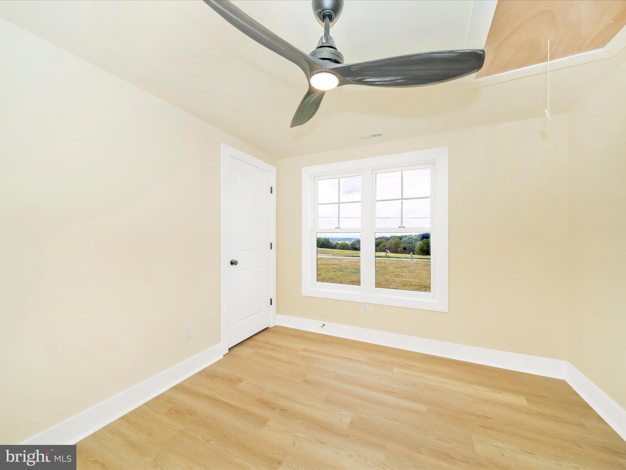 14901 New Windsor Road New Windsor, MD 21776 - Photo 29 of 75 a view of an empty room with a window