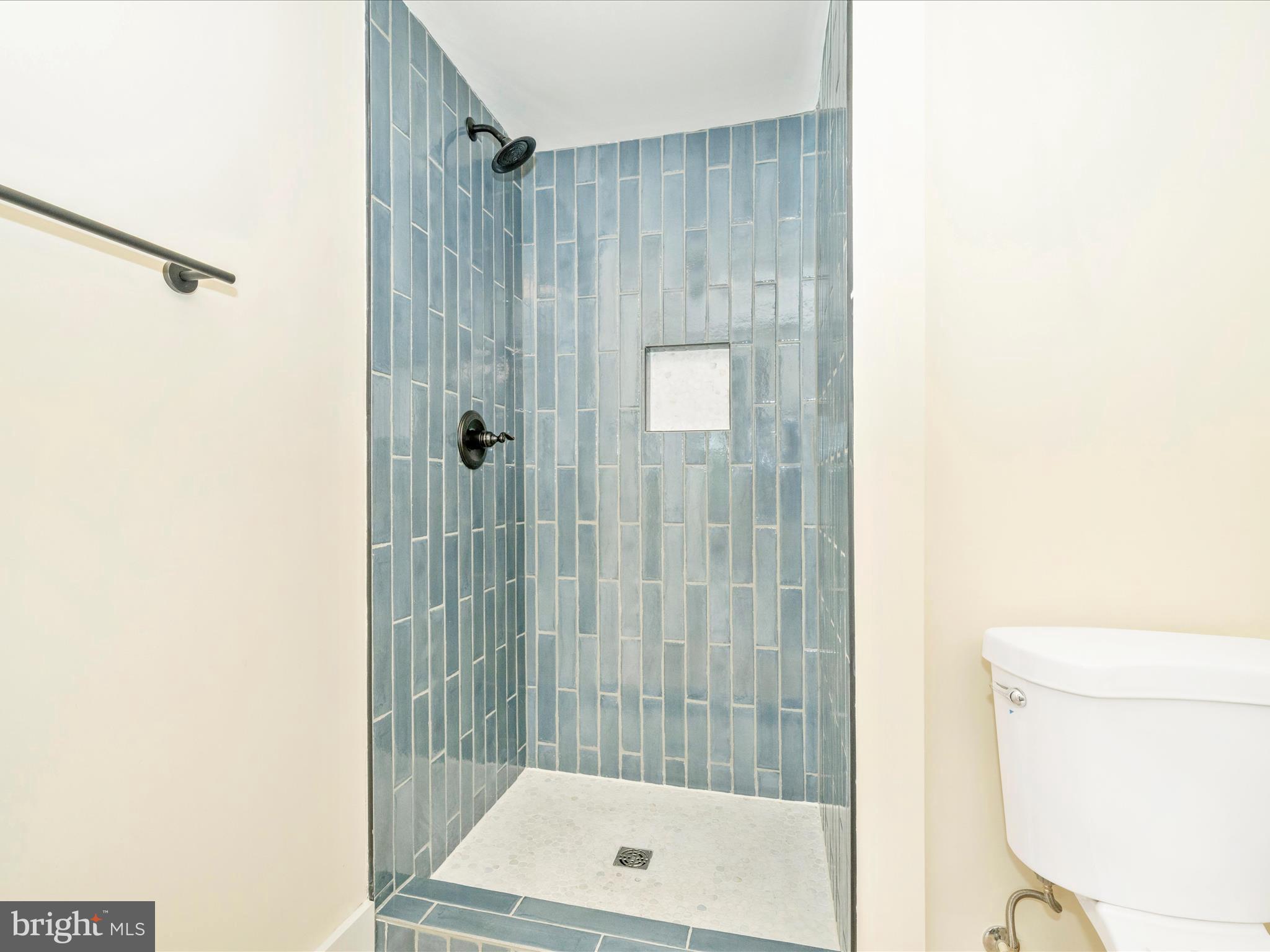 14901 New Windsor Road New Windsor, MD 21776 - Photo 31 of 75 a bathroom with a shower and a toilet