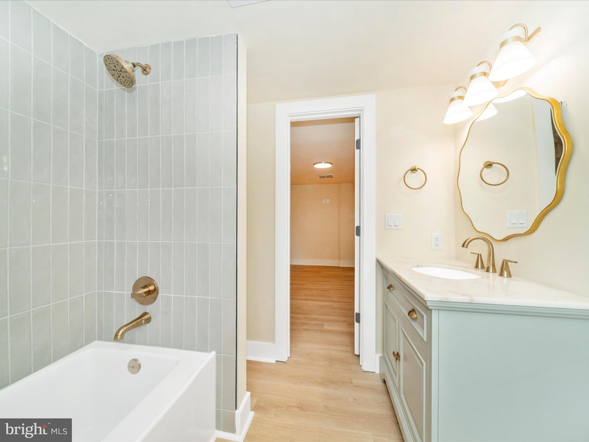 14901 New Windsor Road New Windsor, MD 21776 - Photo 39 of 75 a bathroom with a tub a sink and a mirror