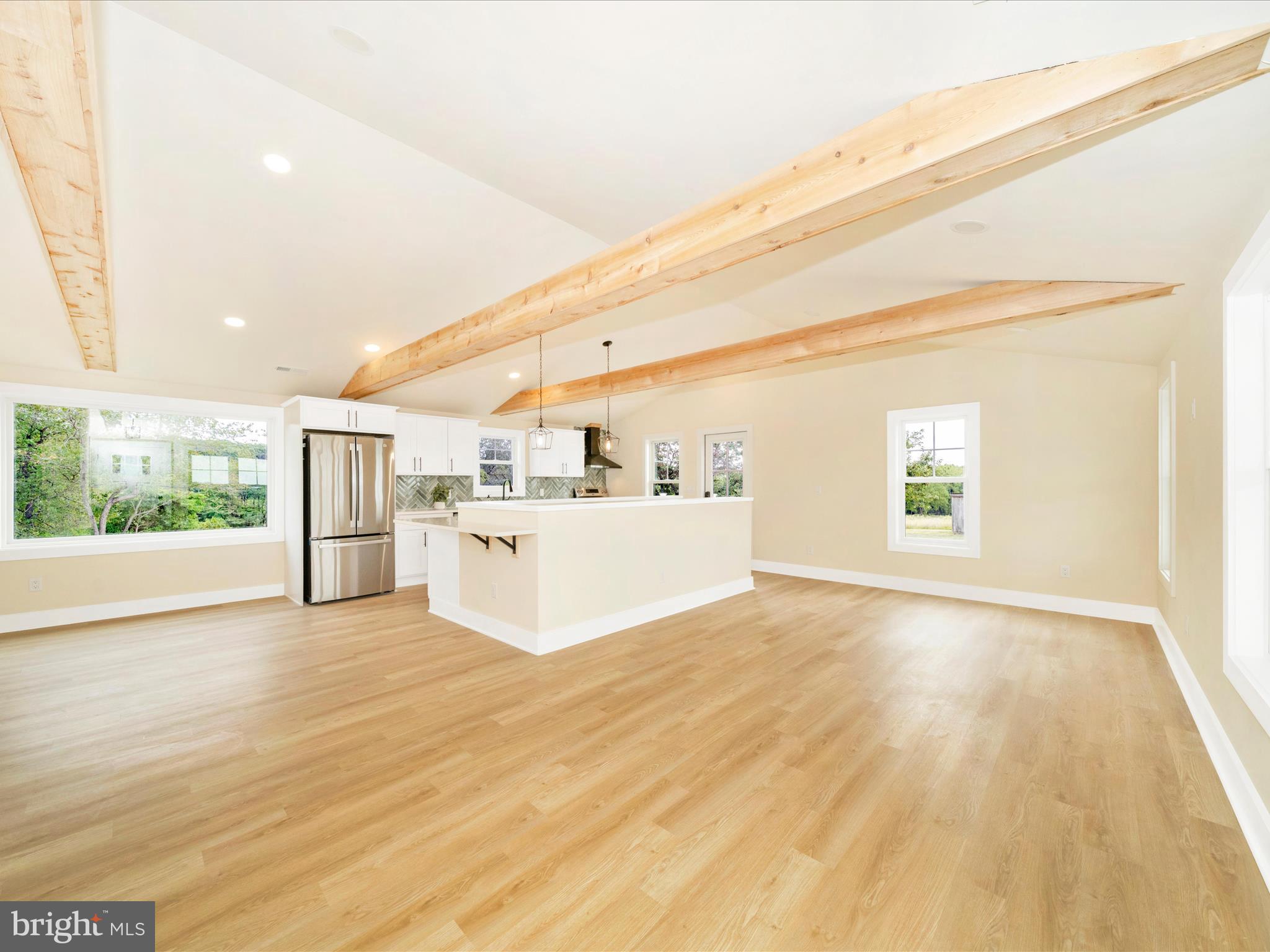 14901 New Windsor Road New Windsor, MD 21776 - Photo 6 of 75 a view of an empty room with wooden floor and a window