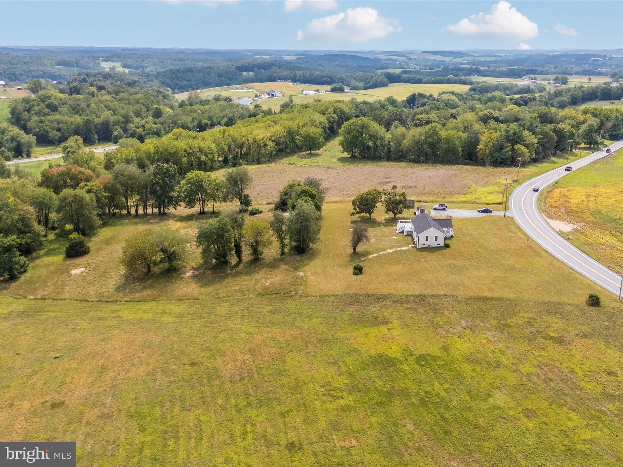 14901 New Windsor Road New Windsor, MD 21776 - Photo 68 of 75 a view of a swimming pool with a table and chairs