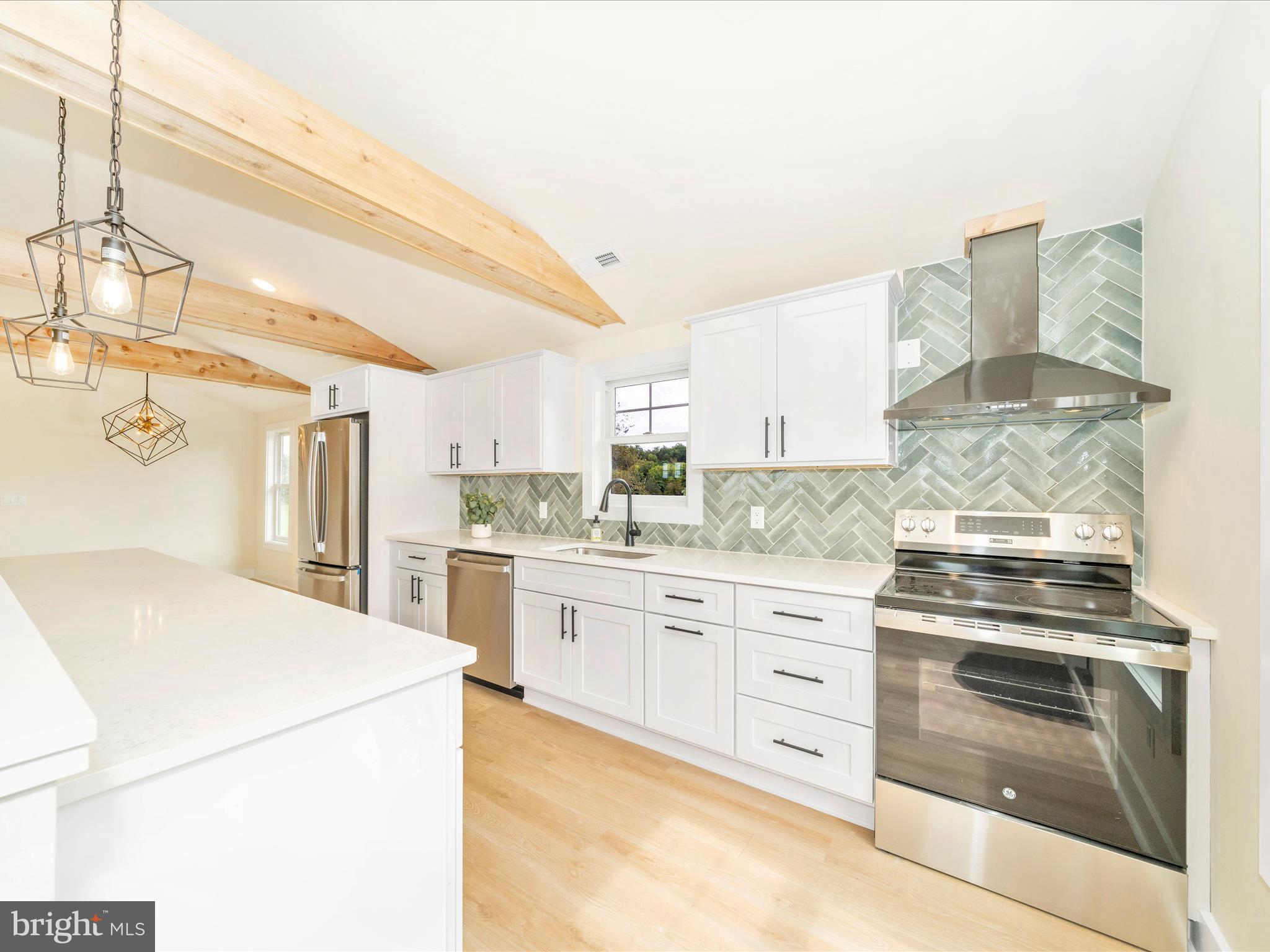 14901 New Windsor Road New Windsor, MD 21776 - Photo 9 of 75 a kitchen with granite countertop white cabinets and white appliances
