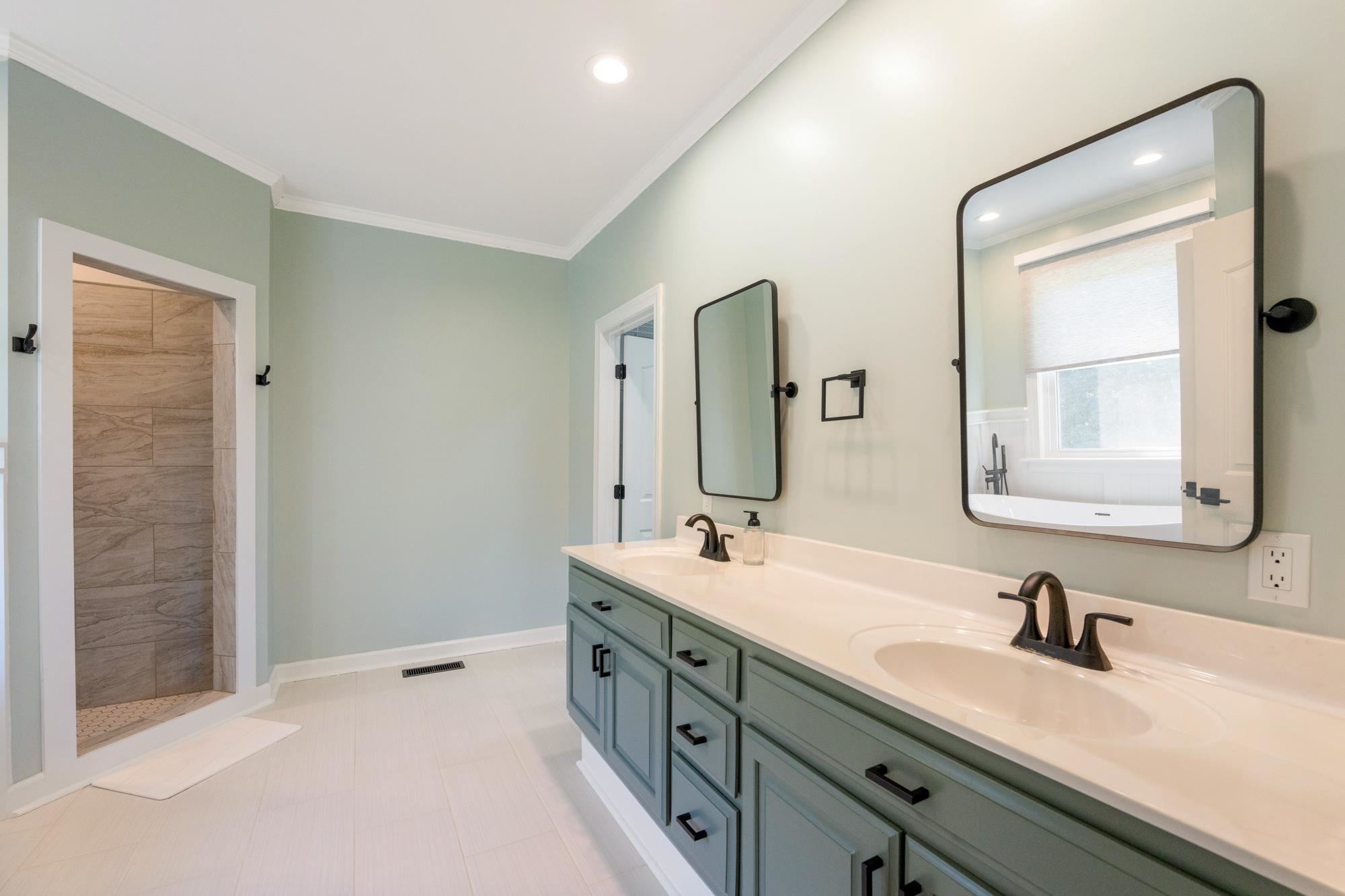 599 DT Vise Loop Parsons, TN 38363 - Photo 21 of 40 Bathroom featuring double vanity, tiled shower, a garden tub, ornamental molding, and recessed lighting