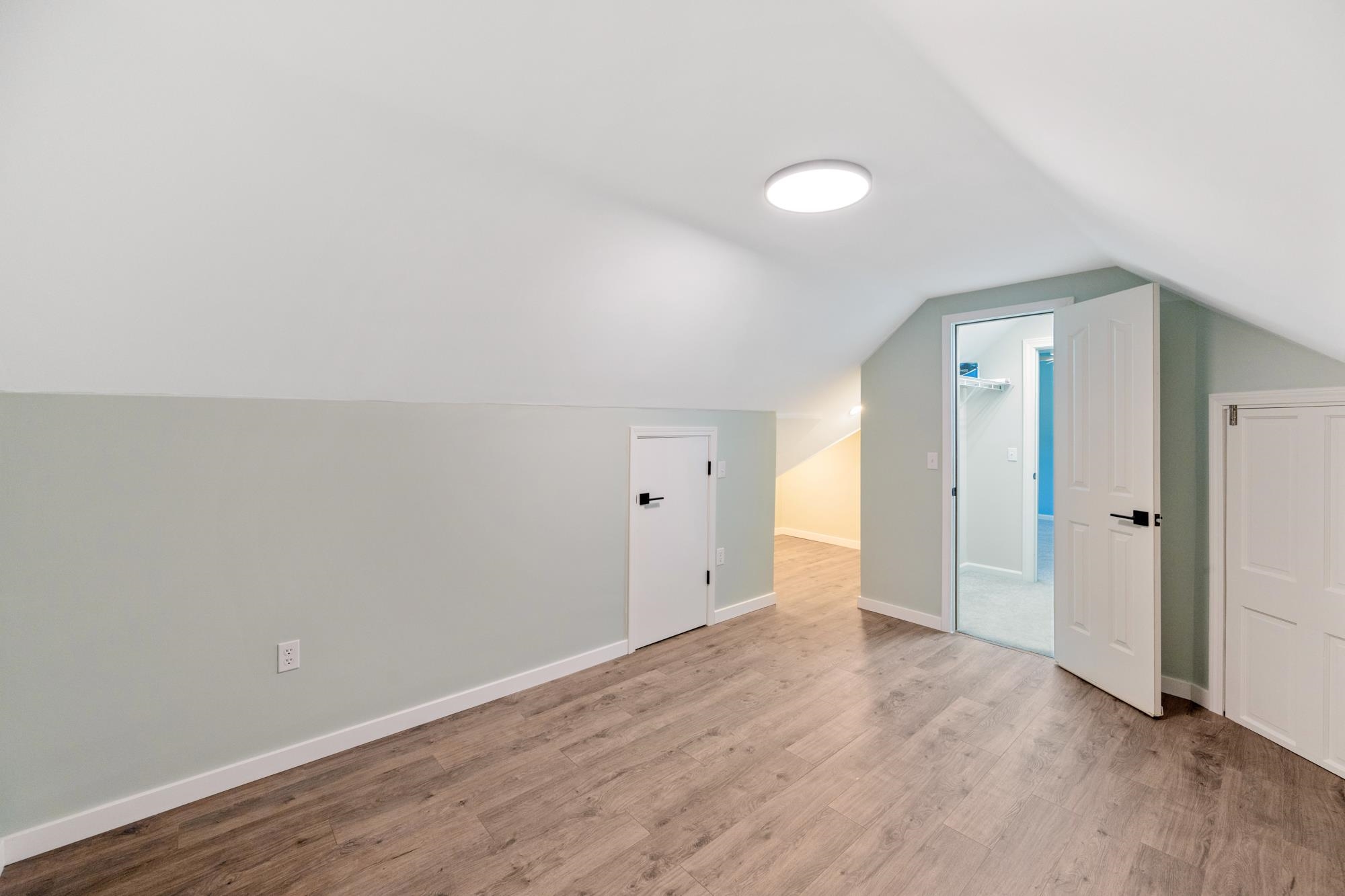 599 DT Vise Loop Parsons, TN 38363 - Photo 25 of 40 Bonus room featuring lofted ceiling and wood finished floors