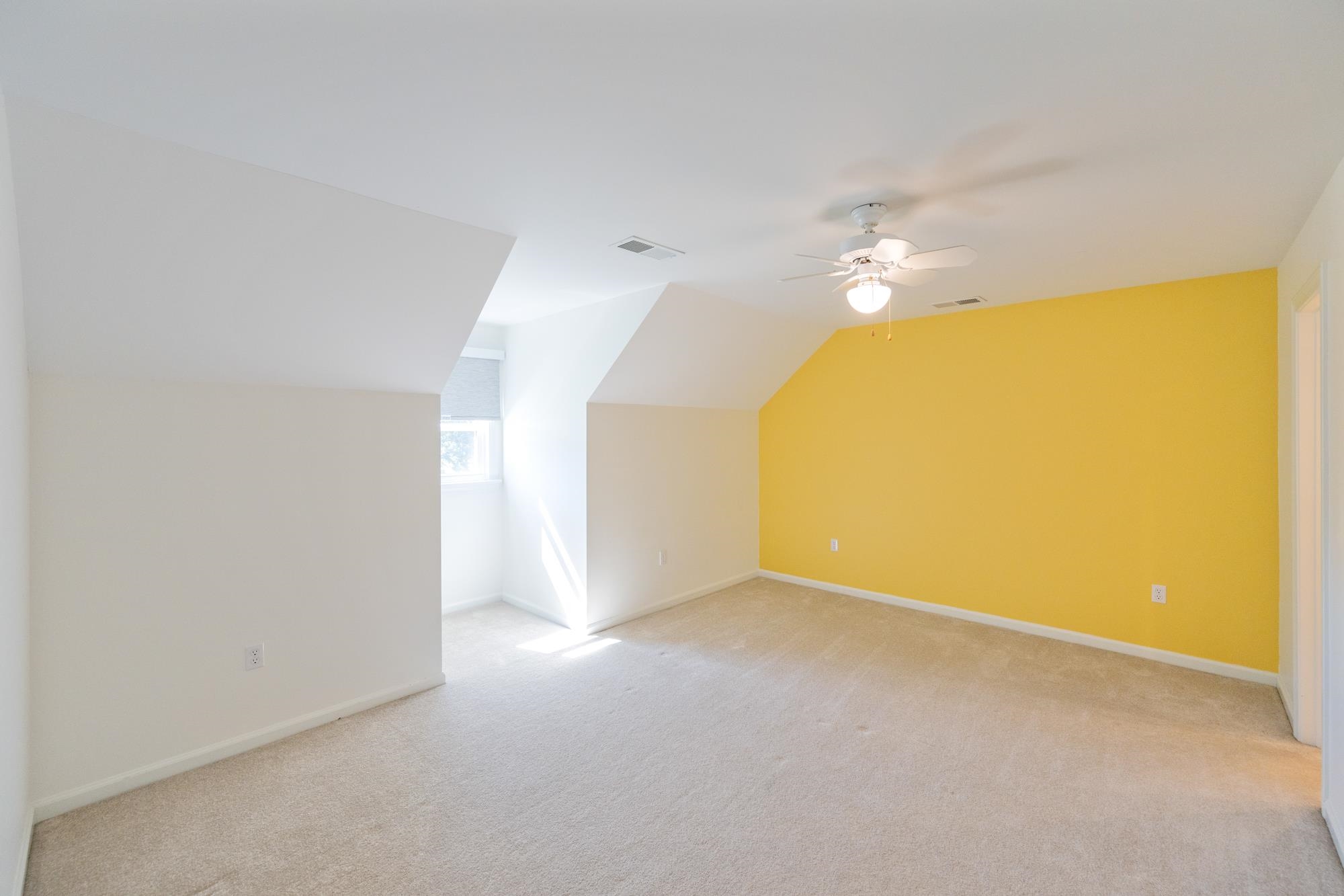 599 DT Vise Loop Parsons, TN 38363 - Photo 28 of 40 Bedroom with light colored carpet, vaulted ceiling, and a ceiling fan