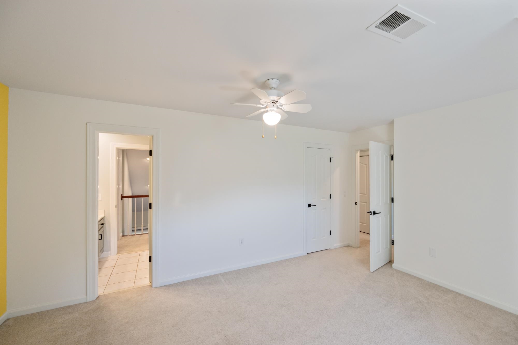 599 DT Vise Loop Parsons, TN 38363 - Photo 29 of 40 Unfurnished bedroom with light colored carpet and a ceiling fan