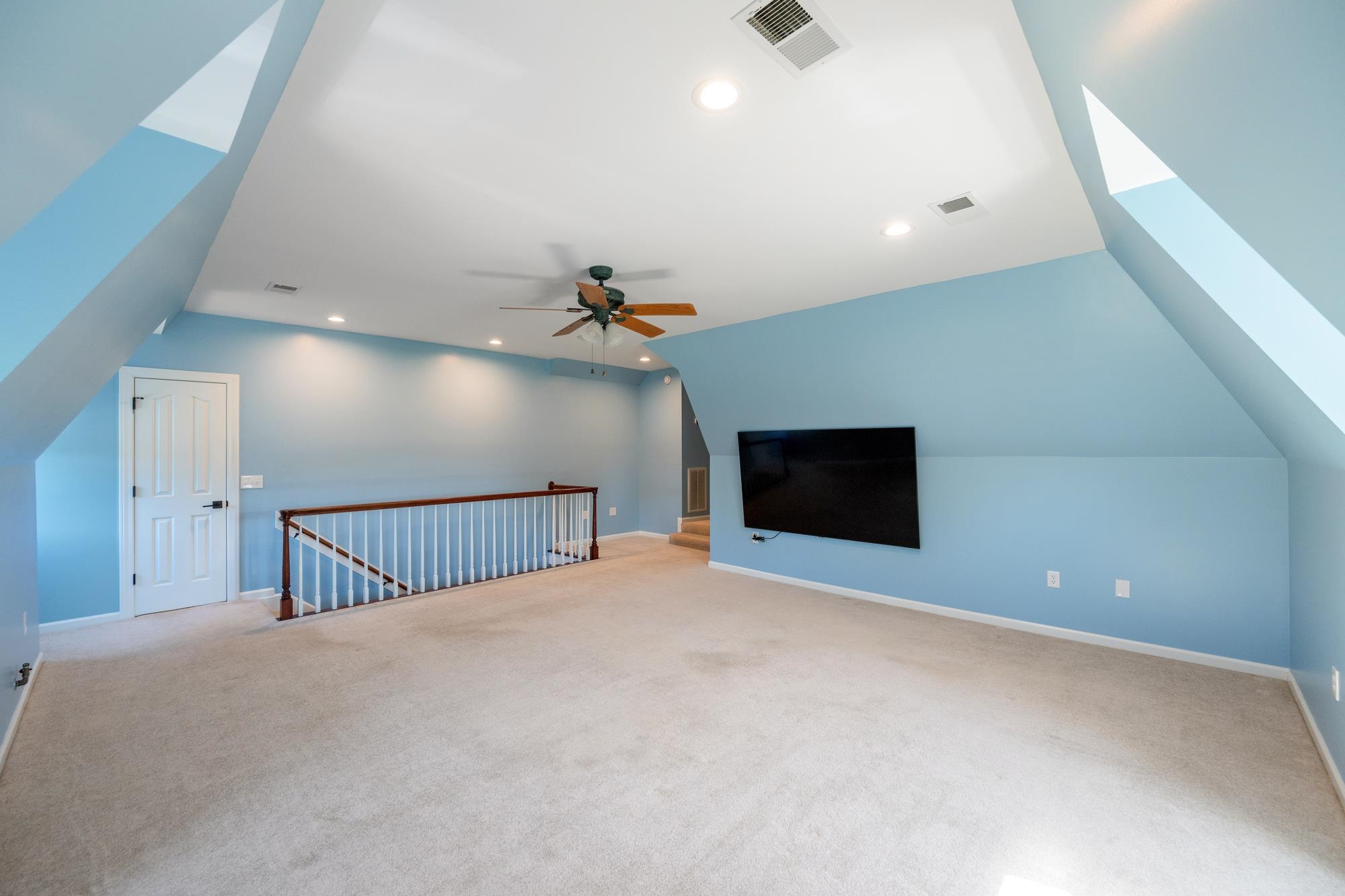 599 DT Vise Loop Parsons, TN 38363 - Photo 32 of 40 Bonus room with vaulted ceiling, carpet, and recessed lighting