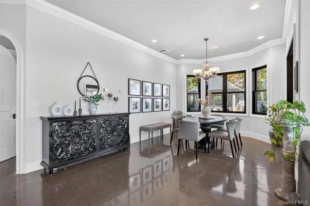 a view of a dining room with furniture and window